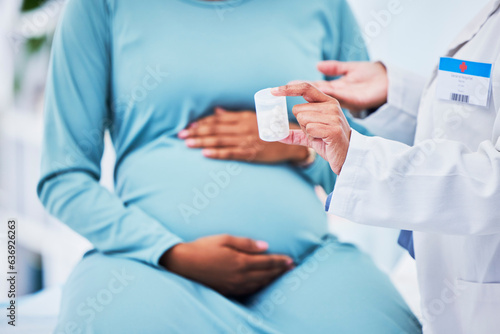 Doctor, pregnant patient and hands, pills in container and woman at hospital with gynecology. Supplements, healthcare and pregnancy, medical advice and fertility, help and trust from gynecologist