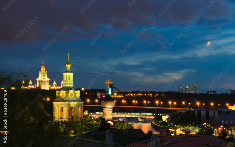 Moscow evening cityscape. View at Lomonosov Moscow State University, Andreevskiy monastery and Luzhniki Metro Bridge.