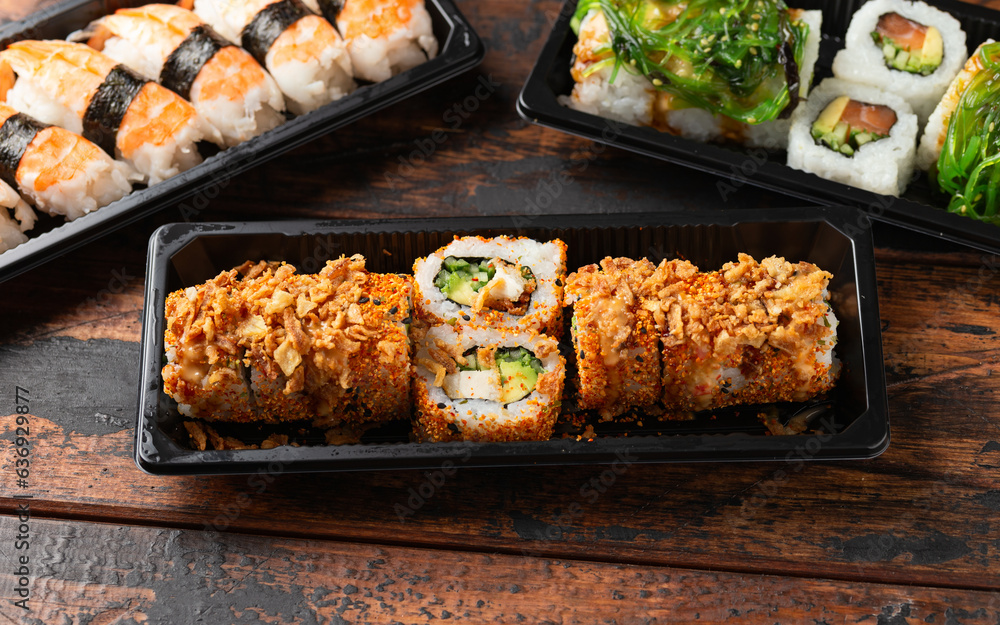 Spicy Sushi roll with prawn, avocado, cucumber. Take away food . Spicy Sushi roll with prawn, avocado, cucumber. Take away food .