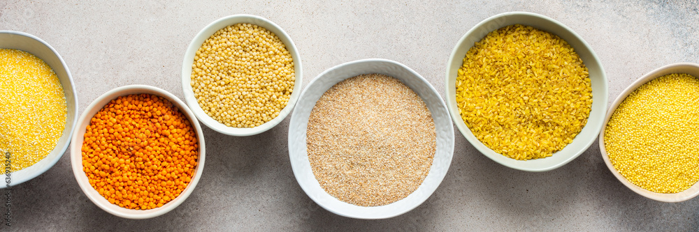 Various grain cereals in bowls banner, top view Various grain cereals in bowls banner, top view