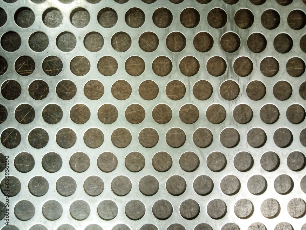 A circular background image taken from a stainless steel plate. A circular background image taken from a stainless steel plate.