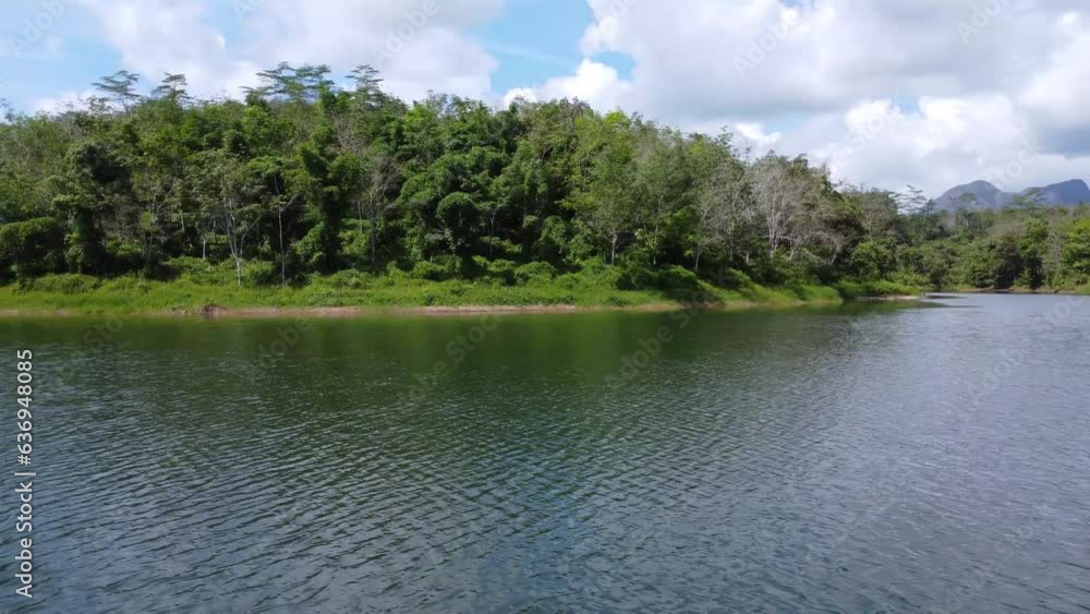 Aerial view of the clear lake with Meratus mountains in the background, the Tanah Bumbu district toll road to Banjar Baru Aerial view of the clear lake with Meratus mountains in the background, the Tanah Bumbu district toll road to Banjar Baru