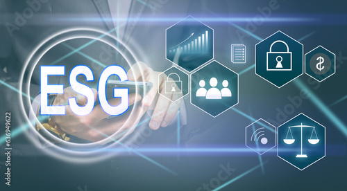 ESG environmental social governance investment business concept. analyze ESG data. icons pop up on virtual screen in business sustainability investment strategy concept
