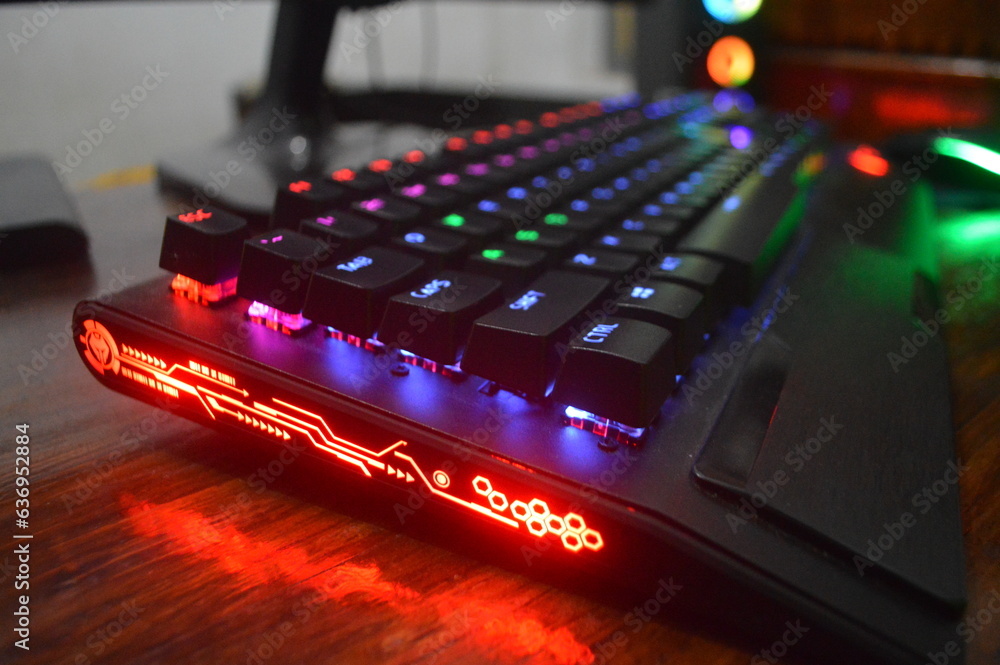 RGB gaming keyboard. Bright colorful keyboard, soft focus. Mechanical keyboard with RGB light, blurred background.