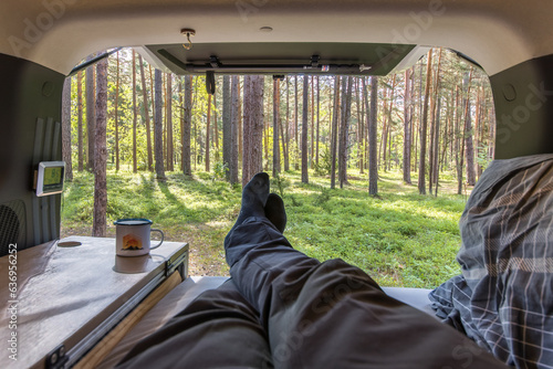 Fototapeta Vanlife in a scandinavian forest using the everymans right