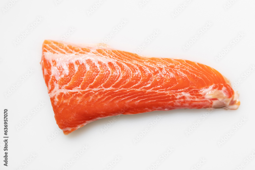 Tail of salmon fillet on white cutting board for delicious salmon steak. Tail of salmon fillet on white cutting board for delicious salmon steak.