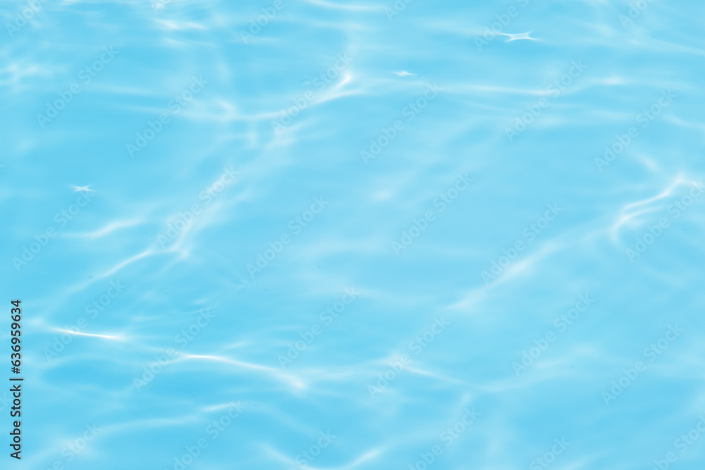 Blue water with ripples on the surface. Defocus blurred transparent blue colored clear calm water surface texture with splashes and bubbles. Water waves with shining pattern texture background. Blue water with ripples on the surface. Defocus blurred transparent blue colored clear calm water surface texture with splashes and bubbles. Water waves with shining pattern texture background.