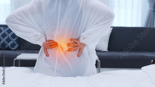 Women patients have muscular back pain, sore back after waking up.