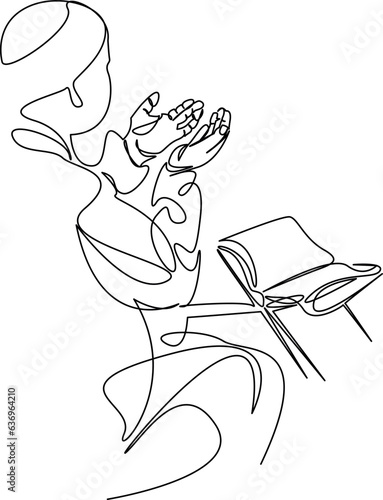 muslim man praying before the quran