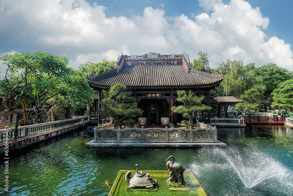 Guangzhou, Guangdong, China. Baomo Garden is located in Panyu District. The garden features common elements of Chinese Lingnan garden architecture such as ponds, bridges, pavilions Guangzhou, Guangdong, China. Baomo Garden is located in Panyu District. The garden features common elements of Chinese Lingnan garden architecture such as ponds, bridges, pavilions