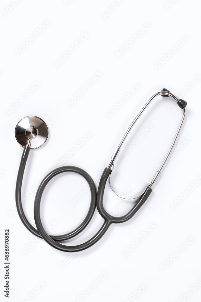 Stethoscope on a white background.Sterile doctors office desk. Stethoscope on a white background.Sterile doctors office desk.