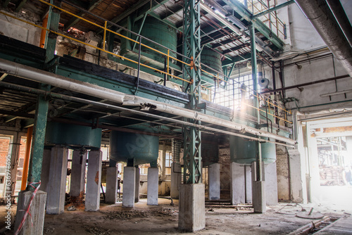 Photo of a massive industrial complex with a maze of pipes and machinery photo