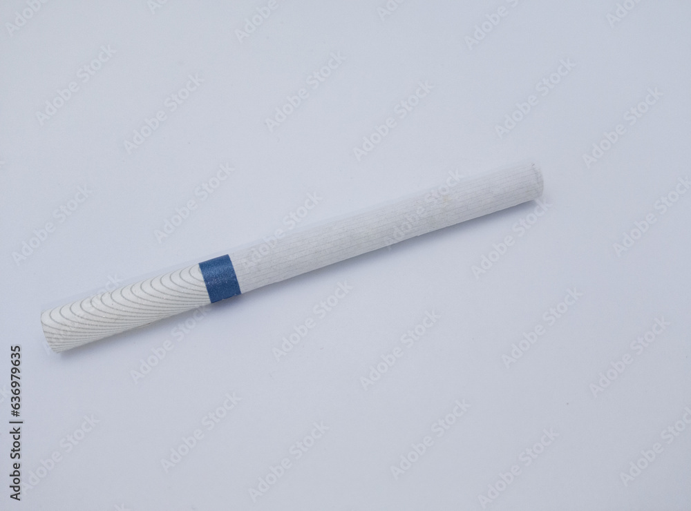 Close-up of a cigarette isolated on white background Close-up of a cigarette isolated on white background