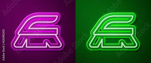 Glowing neon line Brush for cleaning icon isolated on purple and green background. Cleaning service concept. Vector