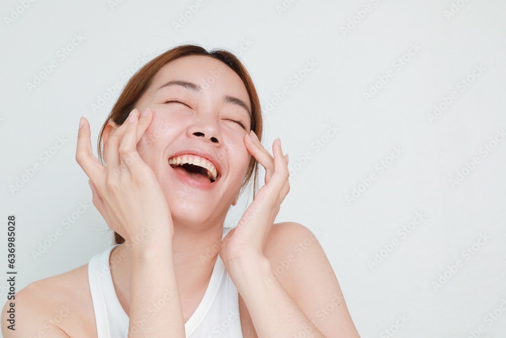 Beautiful Asian woman in natural makeup over isolated background with copy space. Beautiful Asian woman in natural makeup over isolated background with copy space.