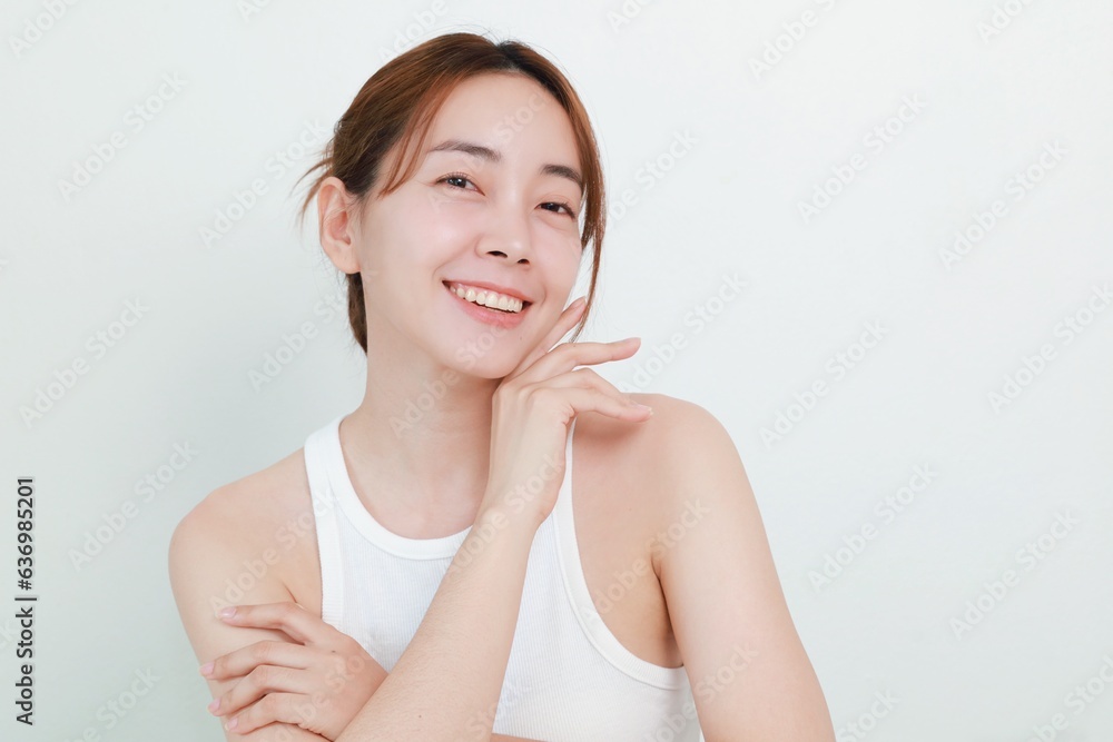 Beautiful Asian woman in natural makeup over isolated background with copy space. Beautiful Asian woman in natural makeup over isolated background with copy space.
