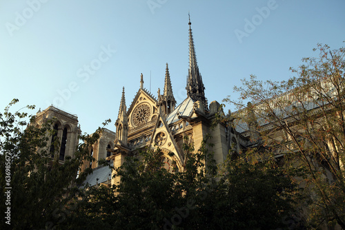 External front view of the Notre Dame Cathedral against blue sky - Paris France