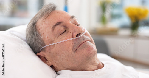 Φωτογραφία Oxygen, hospital bed and senior man sleeping with ventilation and breathing tube support in a clinic