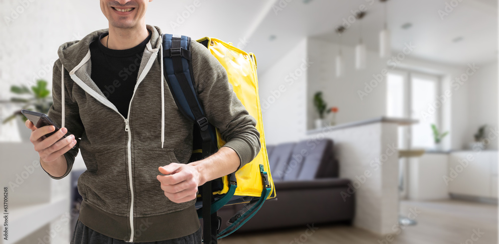 delivery guy employee man workwear yellow thermal food bag backpack work as dealer courier. Service concept delivery guy employee man workwear yellow thermal food bag backpack work as dealer courier. Service concept