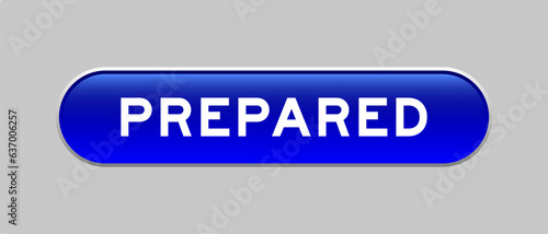 Blue color capsule shape button with word prepared on gray background