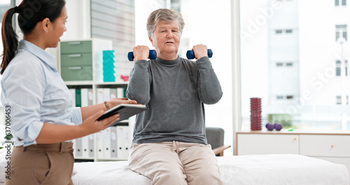 Physical therapy  senior patient with dumbbells and chiropractor with tablet  monitor progress and exercise. Help  support and women at clinic  weightlifting and elderly care with health and physio