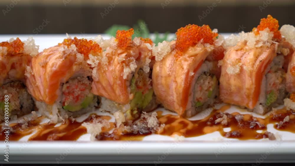 The Perfect Salmon Sushi Roll with Delectable Sauce Presentation The Perfect Salmon Sushi Roll with Delectable Sauce Presentation
