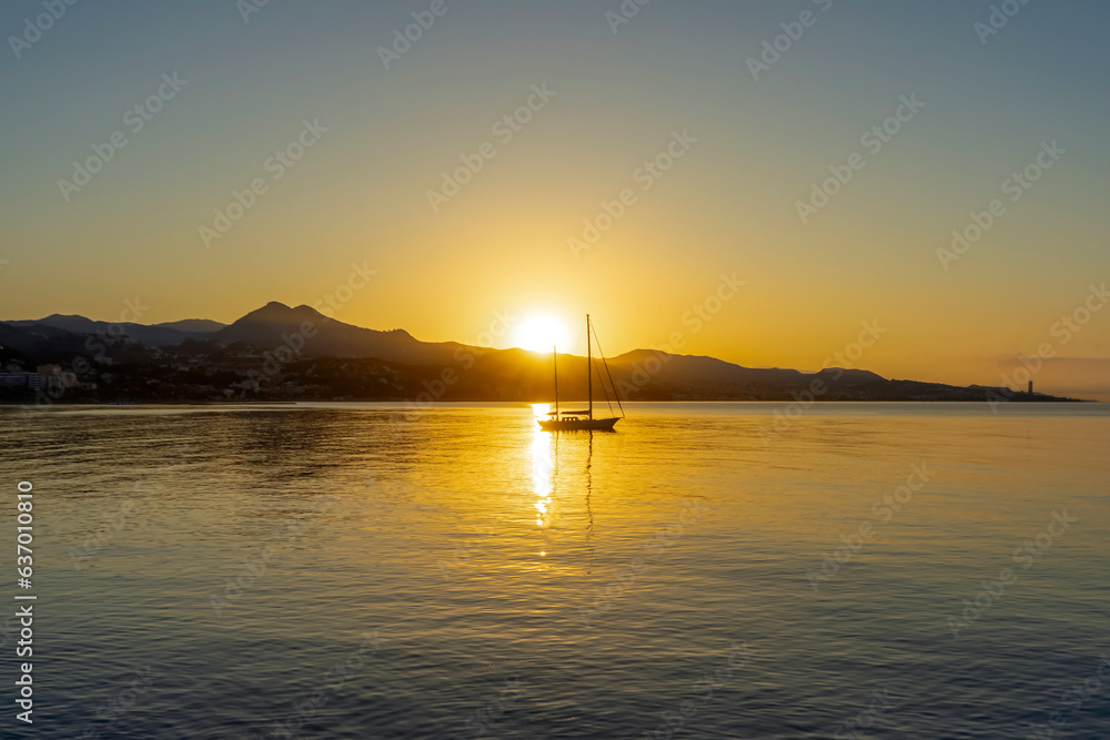 Beautiful sunrise on Malaga coastline, beach Malageta in Malaga, Spain
