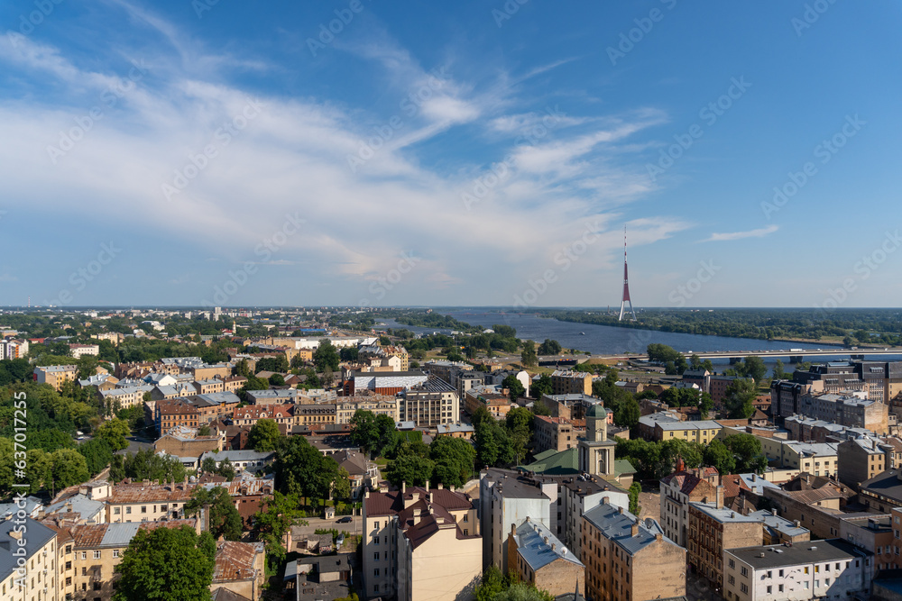 Panoramic of the skyline of the city of Riga captured from the tower of the Riga Academy of Sciences. Photo taken on a sunny day.