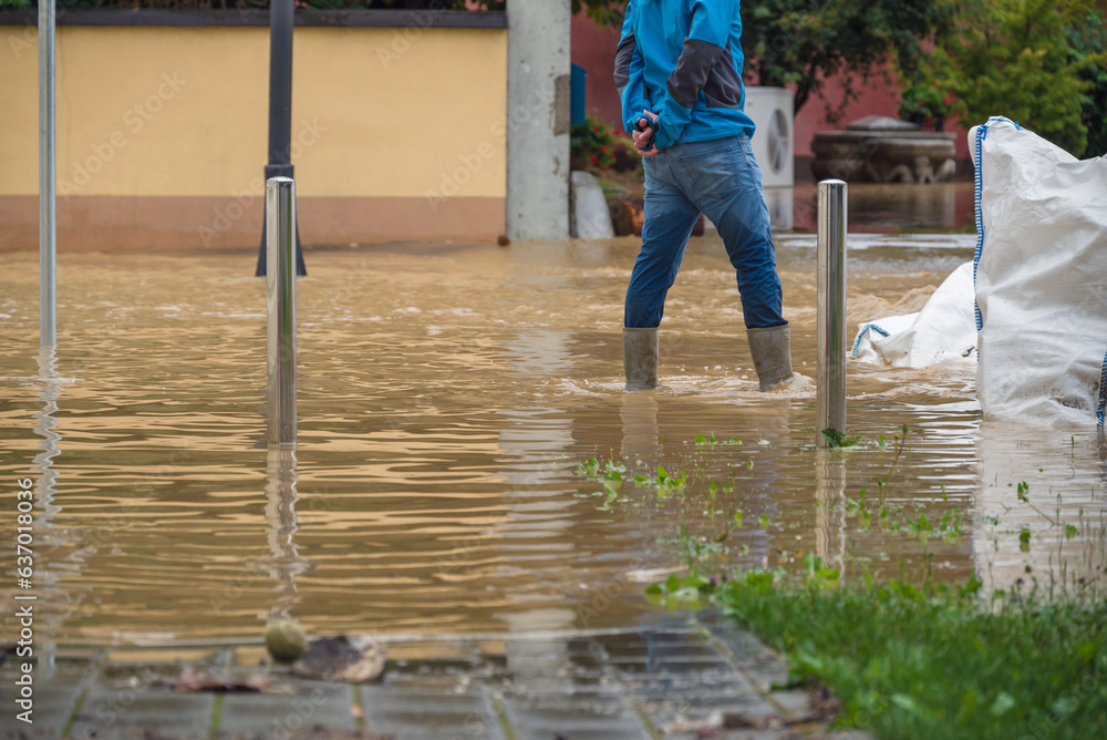 Heavy Rain Disaster Examples People in floods at city streets after heavy rain. Severe weather ...