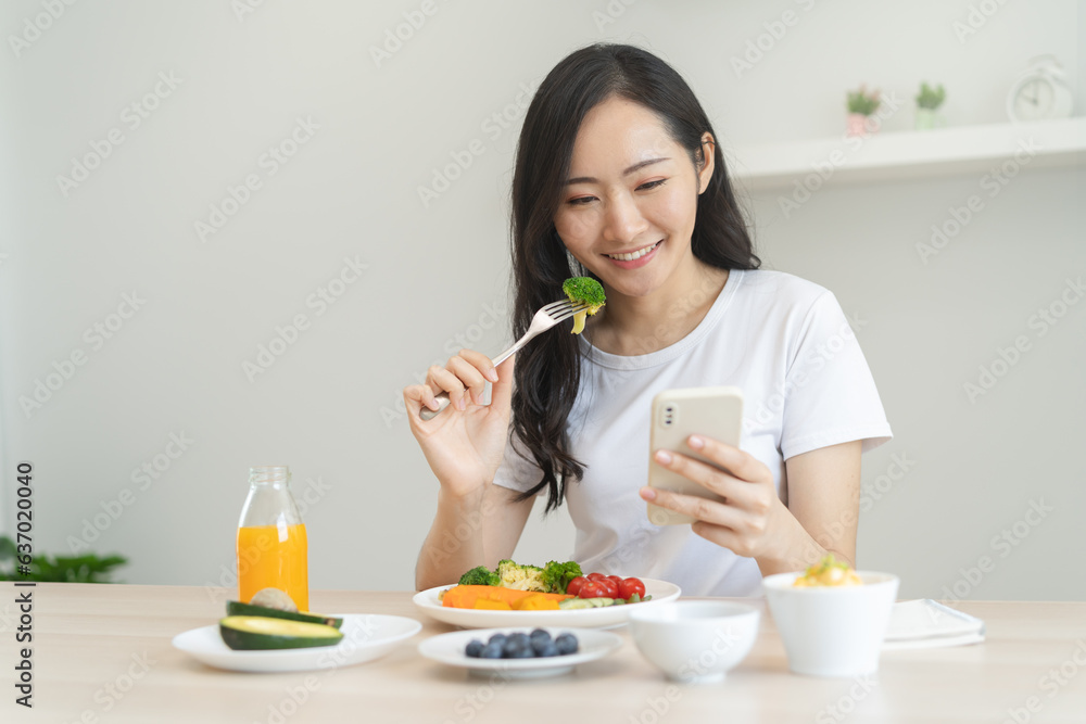 young female planning menu to eat ketogenic diet during weight loss program. young female planning menu to eat ketogenic diet during weight loss program.