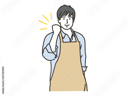 ガッツポーズをするエプロン姿の男性
