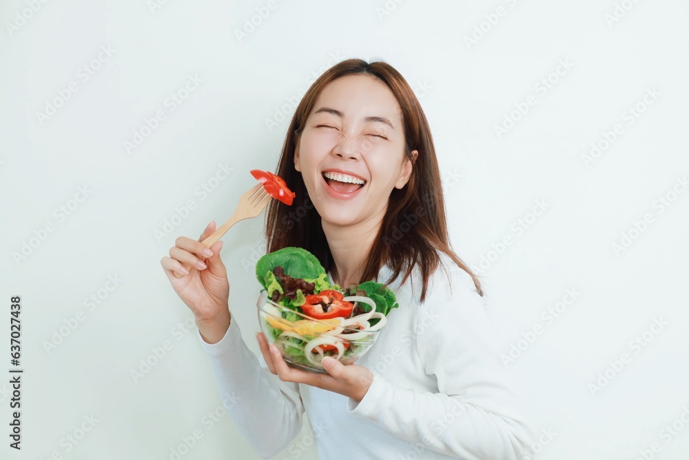 Beautiful Asian woman joyful with salad bowls in her hand, Smiling woman holding organic salad bowl over white background. Beautiful Asian woman joyful with salad bowls in her hand, Smiling woman holding organic salad bowl over white background.