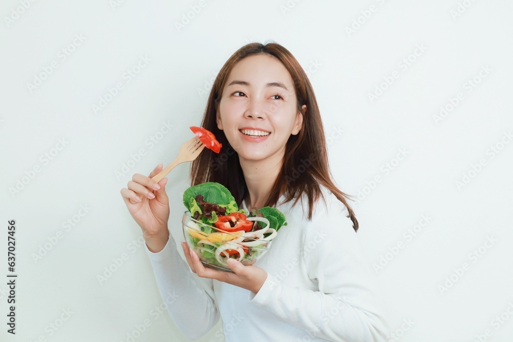 Beautiful Asian woman joyful with salad bowls in her hand, Smiling woman holding organic salad bowl over white background. Beautiful Asian woman joyful with salad bowls in her hand, Smiling woman holding organic salad bowl over white background.