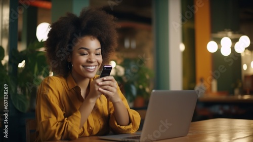 Happy African ethnic girl using mobile cell phone and laptop on campus school background, concept of woman student, college life.