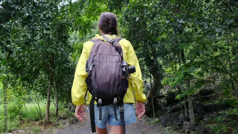 Witness an intrepid female traveler, backpack-clad and camera in hand, as she ventures through vibrant rainforests, evoking a sense of adventure, wanderlust, nature's beauty, and mindful well-being. Witness an intrepid female traveler, backpack-clad and camera in hand, as she ventures through vibrant rainforests, evoking a sense of adventure, wanderlust, nature's beauty, and mindful well-being.
