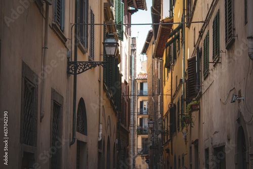 A charming alleyway of Florence  Italy. Lined with traditional shuttered windows and rustic facades  exudes the warmth and historic ambiance of Italy s heartland.