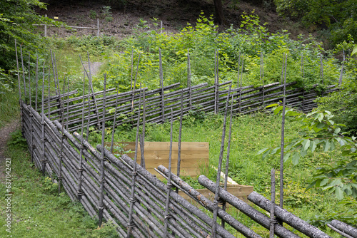 Old hand crafted fence around garden in Scandinavia photo