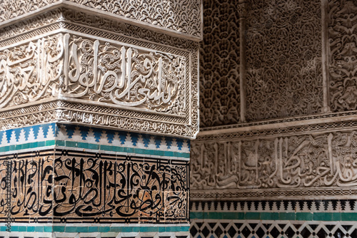 Rich decorated facade in the courtyard of the Medersa Attarine in Fes
