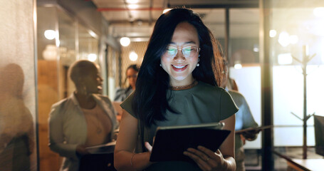 Night, tablet and business people walking in office after finishing work task. Tech, overtime and Asian woman with group of friends going home after working late on sales project in dark workplace.