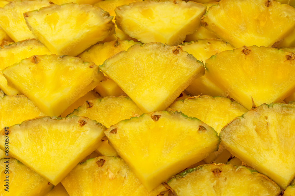 Pineapple juicy yellow slices as a background. Pineapple juicy yellow slices as a background.