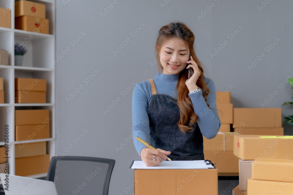 Online business owner are taking on the phone orders for customers, negotiating for delivery. Online business owner are taking on the phone orders for customers, negotiating for delivery.