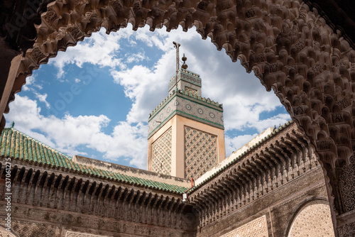 Traditional oriental facade at the courtyard of madrasa Bou Inaniya in the medina of Fes photo