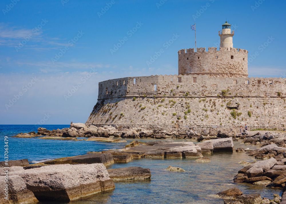 Mandraki port and fort of St. Nicholas. Rhodes, Greece. Hirschkuh statue in the place of the Colossus of Rhodes, Rhodes, Greece travel in summer sunny day