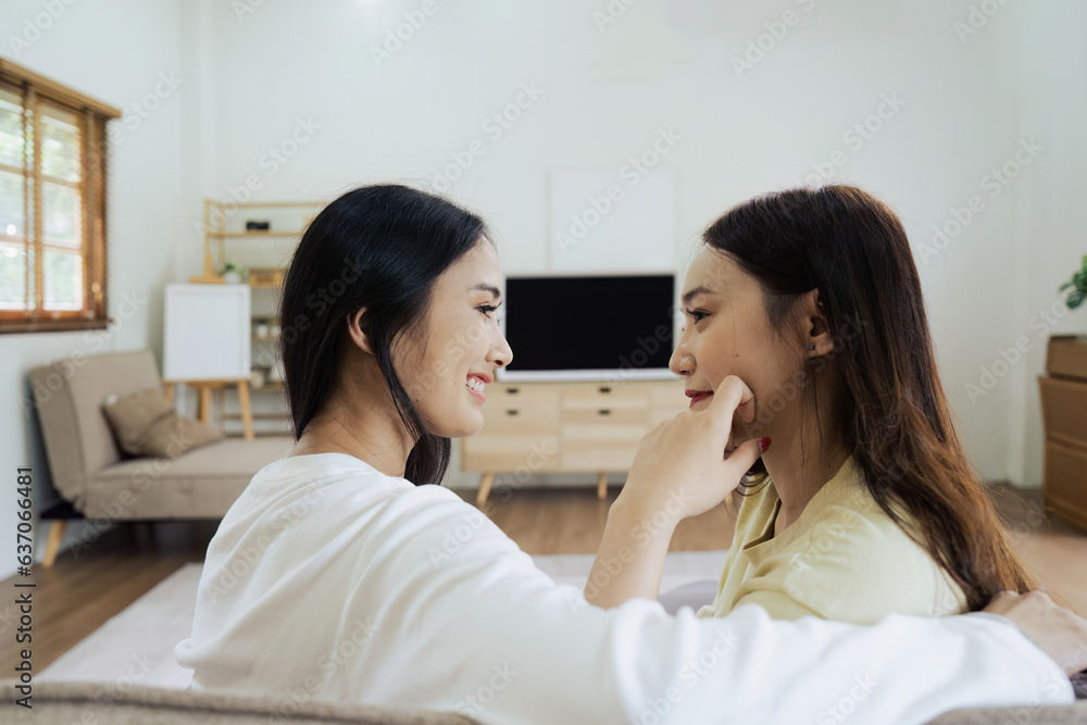 Asian lesbian woman couple enjoy watch TV together in house and feel happy watch movie on television. Homosexual-LGBTQ concept. Asian lesbian woman couple enjoy watch TV together in house and feel happy watch movie on television. Homosexual-LGBTQ concept.