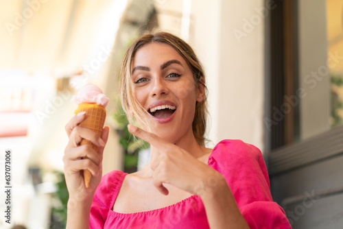 Young blonde woman at outdoors