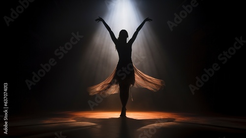  In a dimly lit ballet studio, the graceful silhouette of a woman dances with elegance. an unrecognisable silhouette of woman dancing in a ballet studio, Dark light  © Mohsin