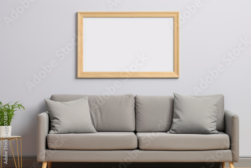 Blank white wall art mockup. One horizontal frame with wooden border. Living room