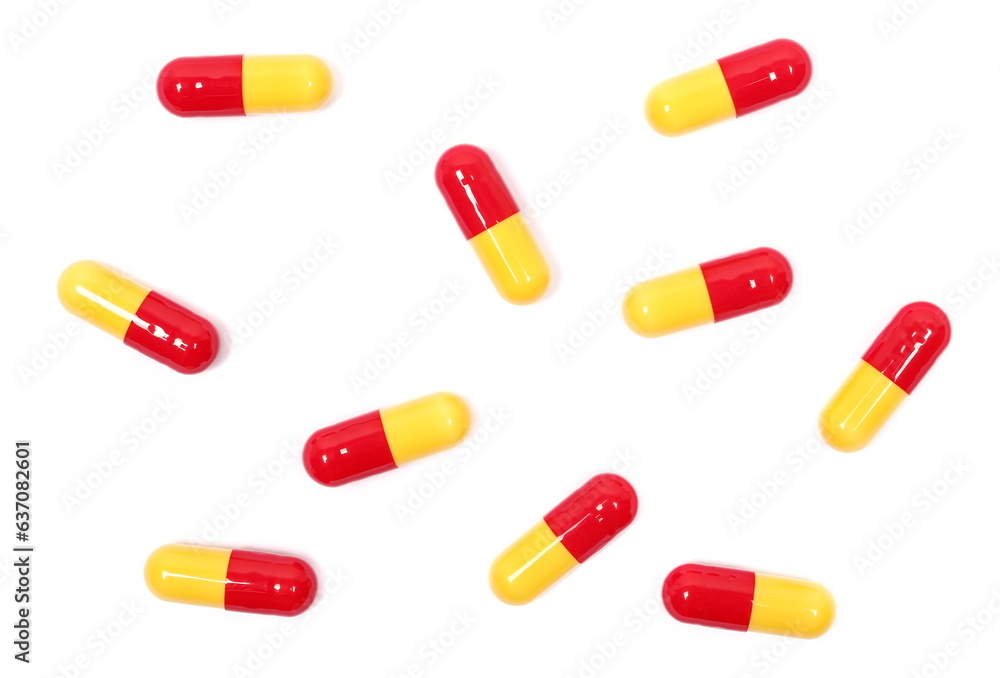 Red yellow capsules isolated on white, clipping