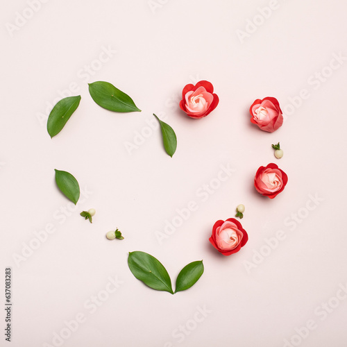 Red soap flowers on pink background top view. Simple modern, minimal flowers concept. Airy and light. Trendy floral minimalism. Flat lay image with copy space