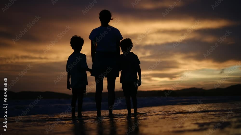 happy family. mother and kids by the sea at sunset silhouette. mother and child kids reach out to the sun. kid dream concept. happy family little kids and dad alone with nature relax sunset concept happy family. mother and kids by the sea at sunset silhouette. mother and child kids reach out to the sun. kid dream concept. happy family little kids and dad alone with nature relax sunset concept